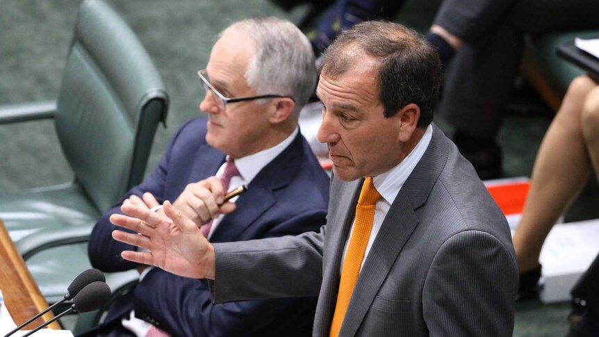 Mal Brough addresses parliament with Julie Bishop and Barnaby Joyce sitting in the background.