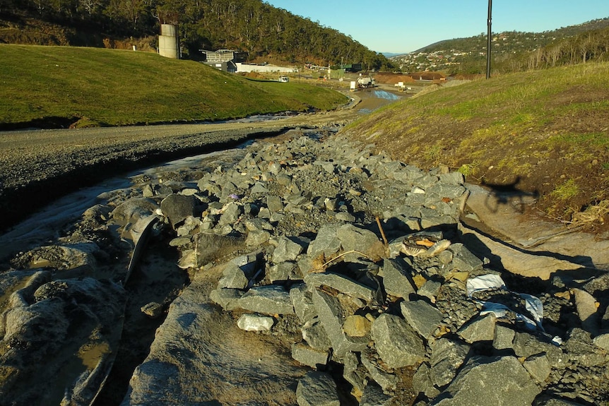 Road at McRobies Gully Tip washed sway by flood water