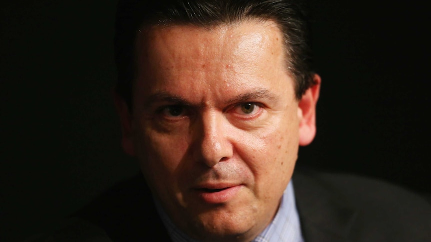 A close-op portrait of Senator Xenophon, surrounded by a black background.