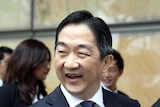 A Malaysian man in a suit 