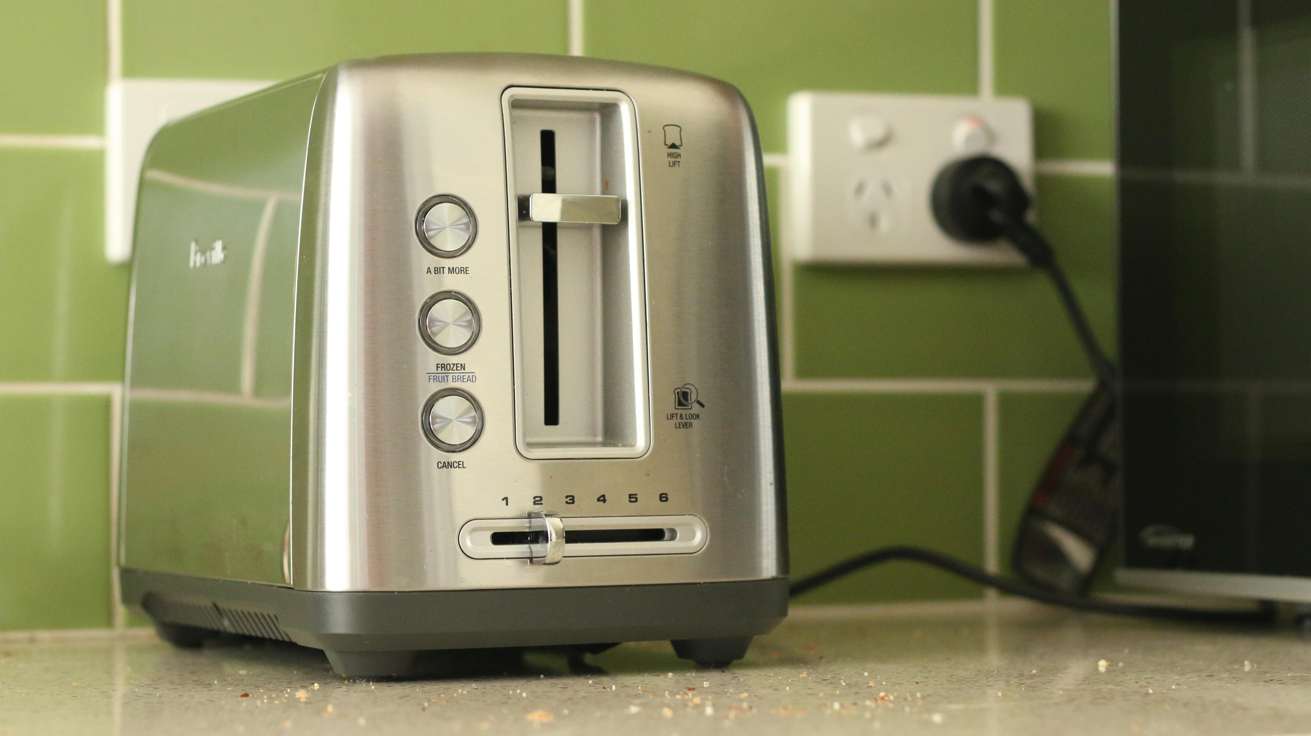 A toaster on a kitchen bench. 