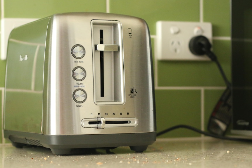 A toaster on a kitchen bench. 