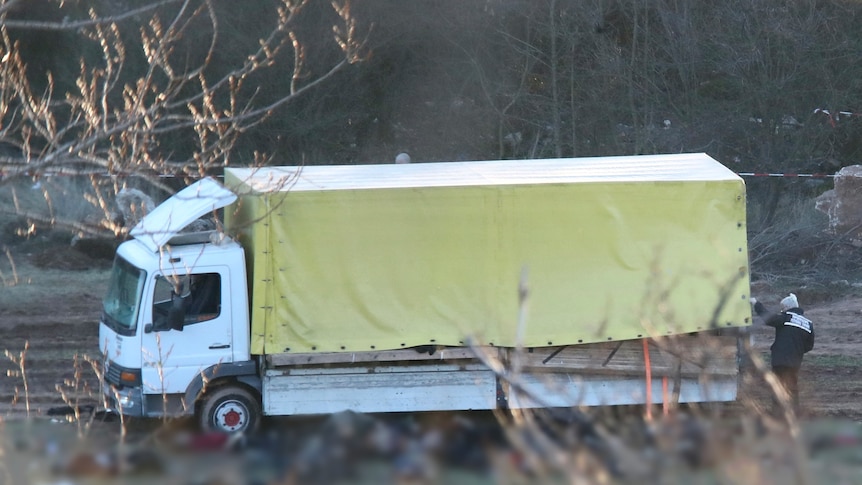 A large white and yellow truck. 
