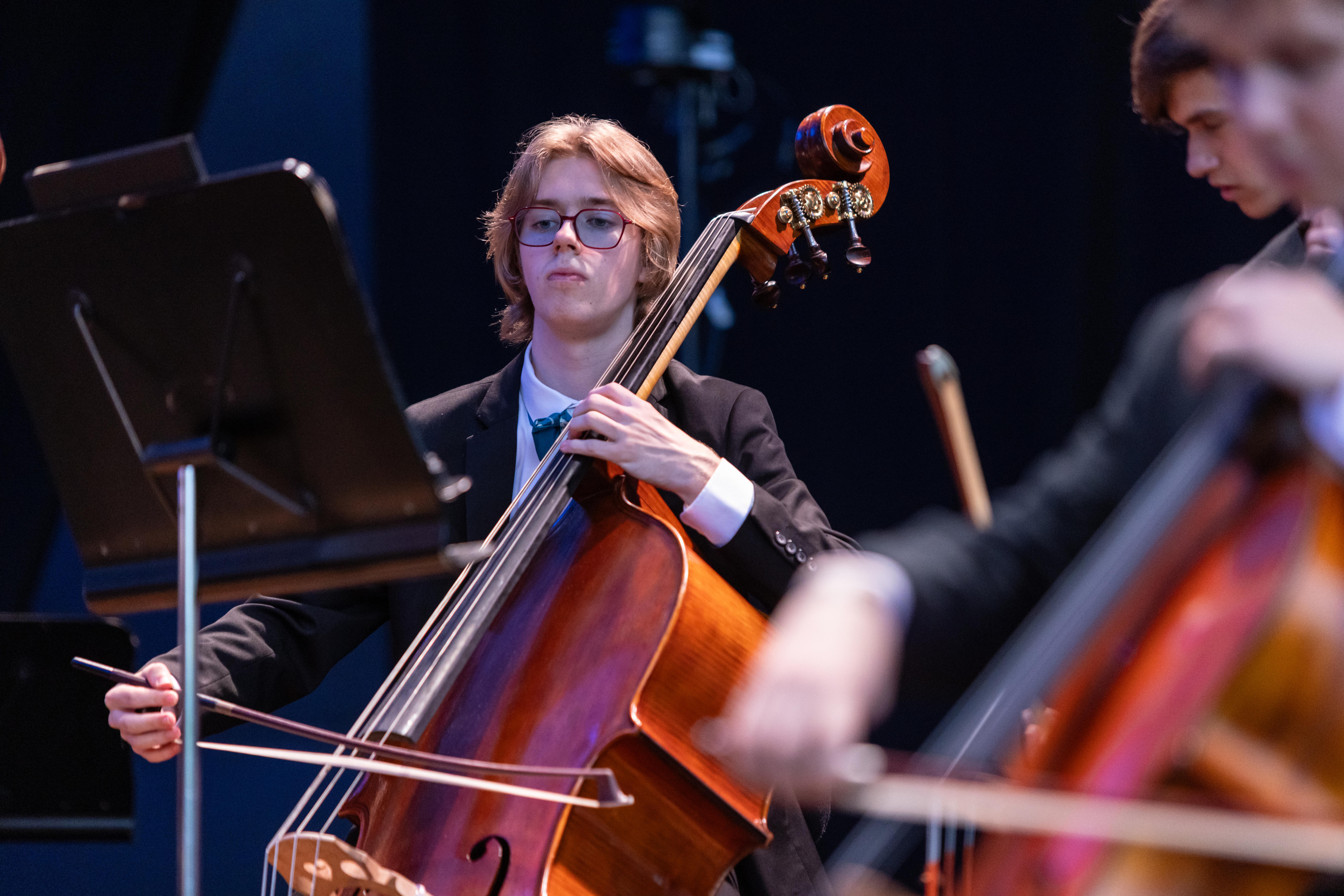 Oliver Murphy playing double bass in the Australian Youth Orchestra.