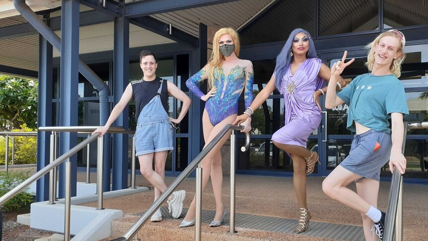 4 drag queens, two dressed up in front of the ABC Kimberley building