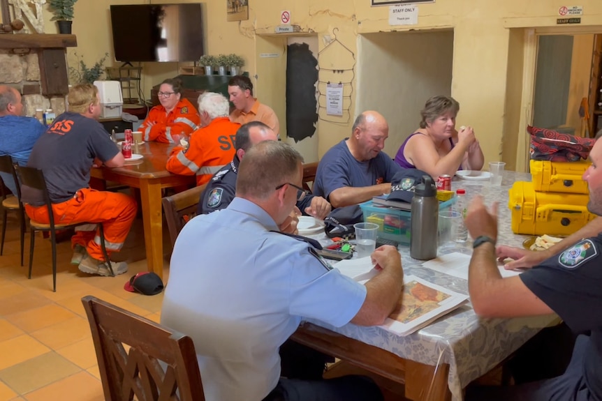 People eat at a country pub. 