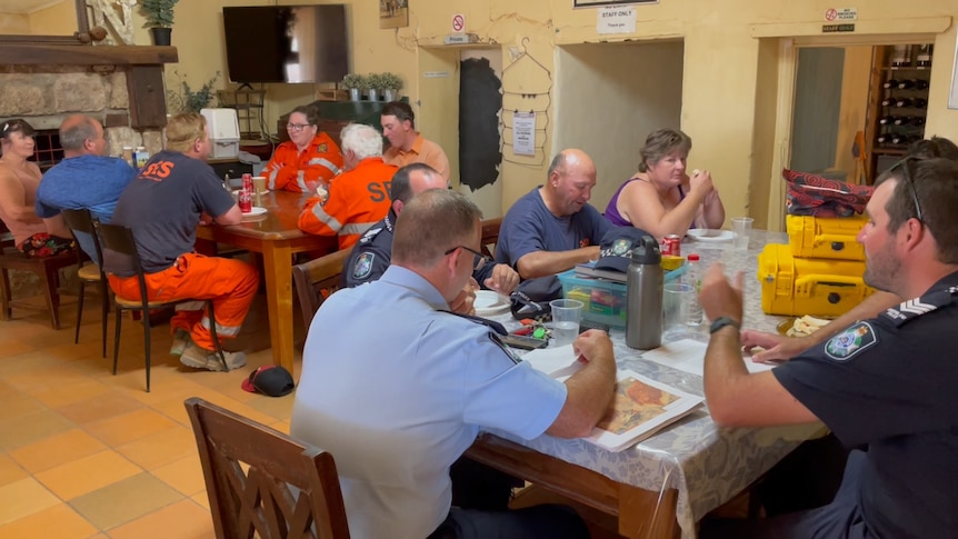 People eat at a country pub. 