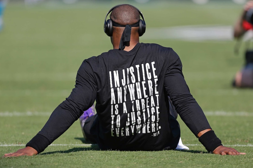 Carolina Panthers quarterback Cam Newton wears a shirt with Martin Luther King quote before NFL game against Minnesota