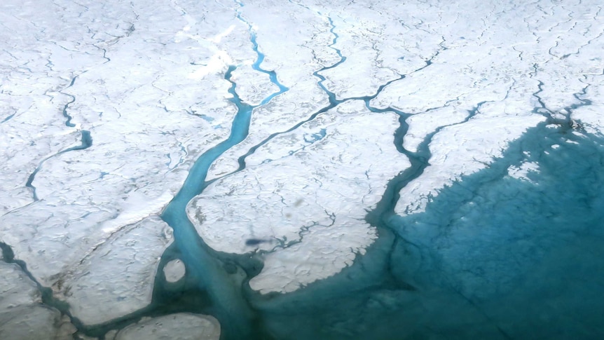 Aerial image of rivers and meltwater lakes on the Greenland ice sheet.
