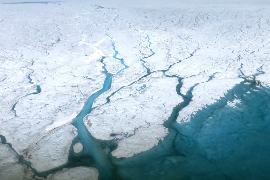 Aerial image of rivers and meltwater lakes on the Greenland ice sheet.