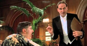 A waiter tempts Mr Creosote with a wafer-thin mint in Monty Python's Meaning of Life.