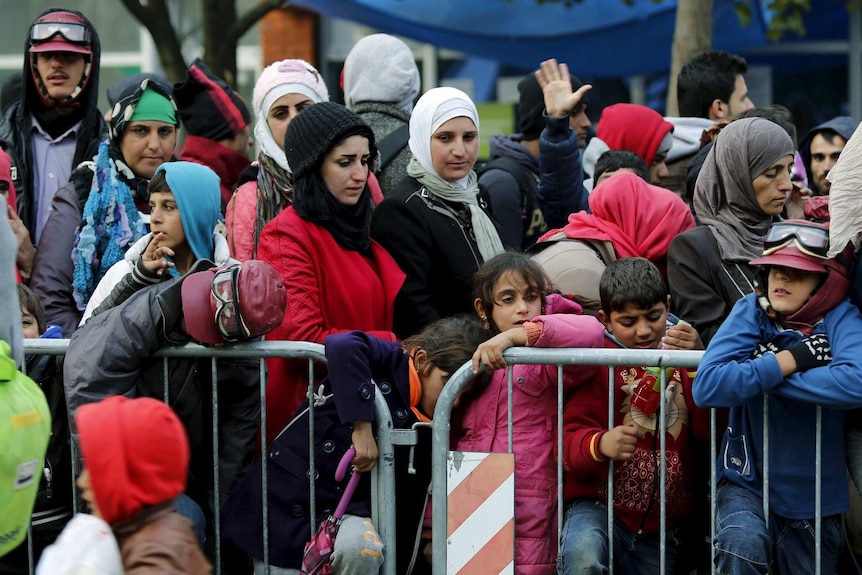 Asylum seekers wait to enter registration camp in Serbia