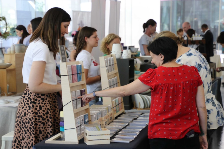 People browse items at a shop in Perth