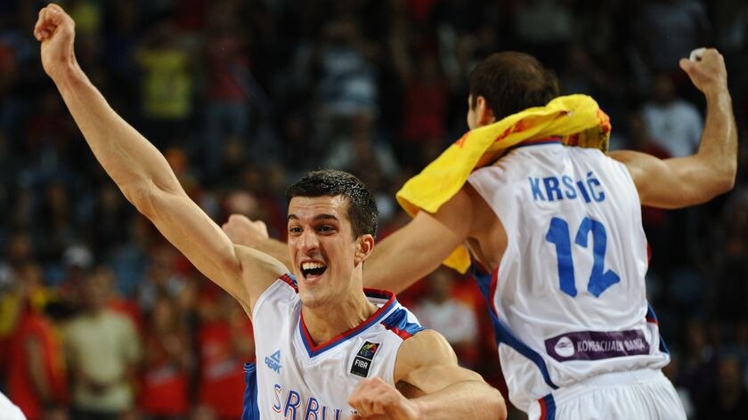 Serbia's Marko Keslj celebrates his side's tense win over the champions.