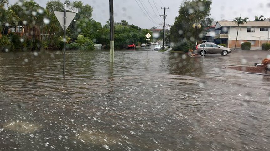 Wellington Street flooded in Coorparoo after a heavy downpour