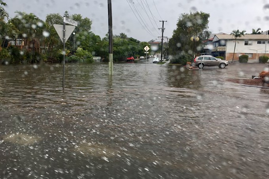 Wellington Street flooded in Coorparoo after a heavy downpour