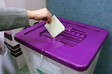 House of Reps ballot going into ballot box at pre-polling station