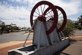 An old mining winch repurposed as street art on Salmon Gum Road in Kambalda.