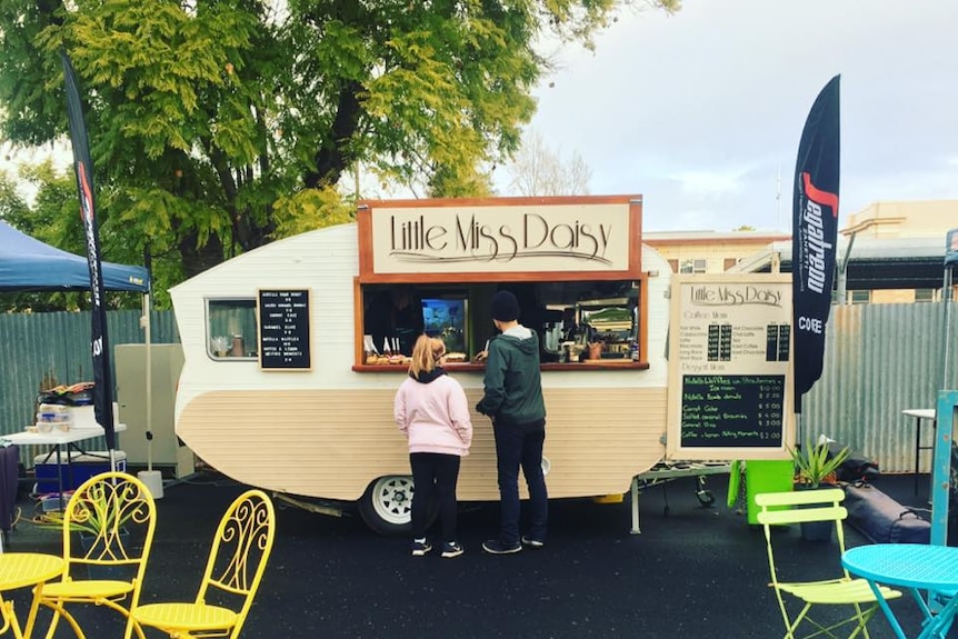 A vintage van used as a cafe.