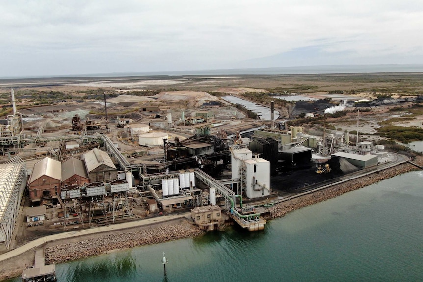 A view from above of an industrial site of Nyrstar's smelter with vacant land in the background.