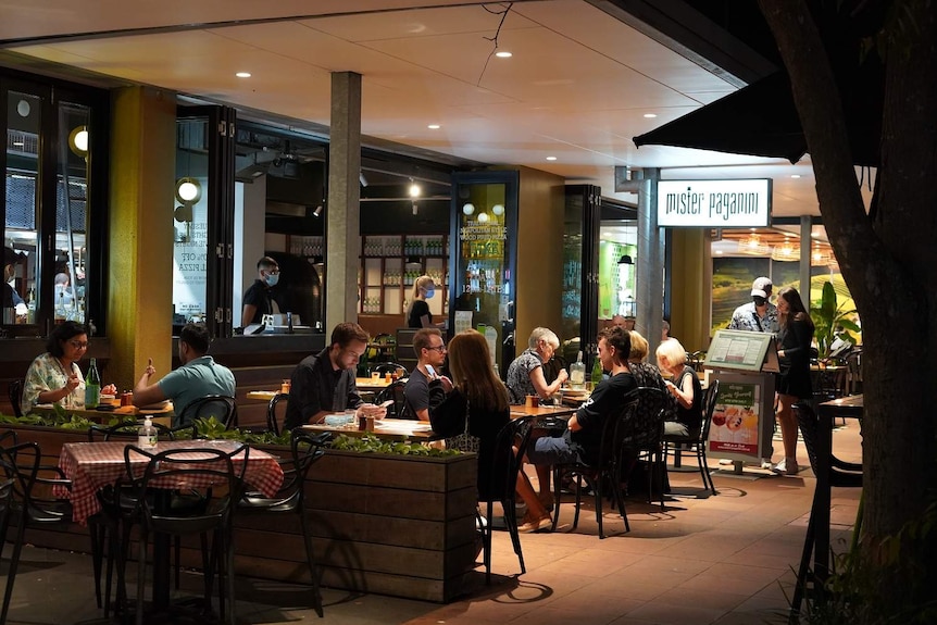 People eat at restaurants along Brisbane's Southbank.