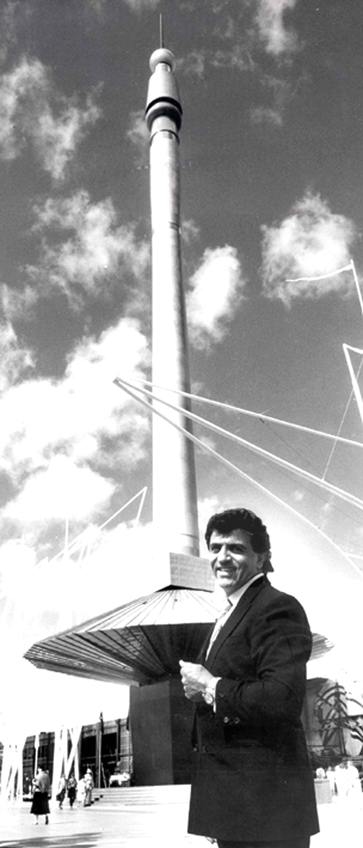 A black and white photo of Stefan with a large building in the shape of a needle. 