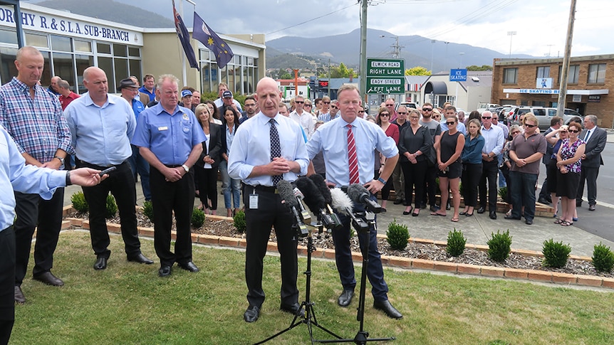 Treasurer Peter Gutwein with Premier Will Hodgman in front of a crowd in front of Glenorchy RSL.