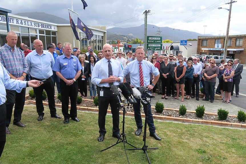 Treasurer Peter Gutwein with Premier Will Hodgman in front of a crowd in front of Glenorchy RSL.