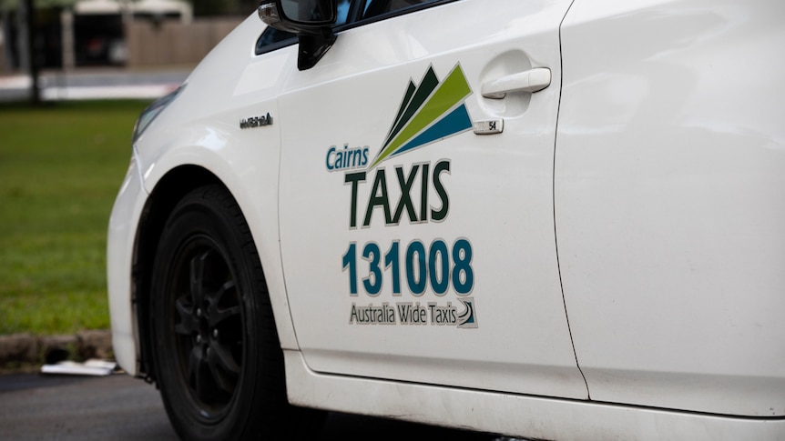 Close up of Cairns Taxis decal on a car.