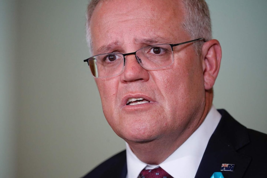 A close up of a man's face looking concerned