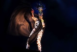 Grace Jones wear a tribal-like outfit on stage.