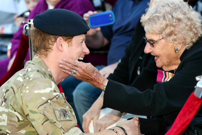 Prince Harry meeting with a Royal follower.