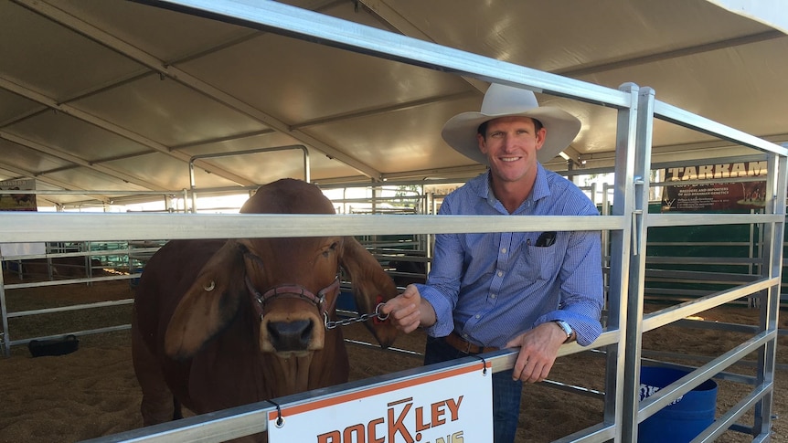 Ashley Kirk is smiling after a top sale at the World Brahman Congress