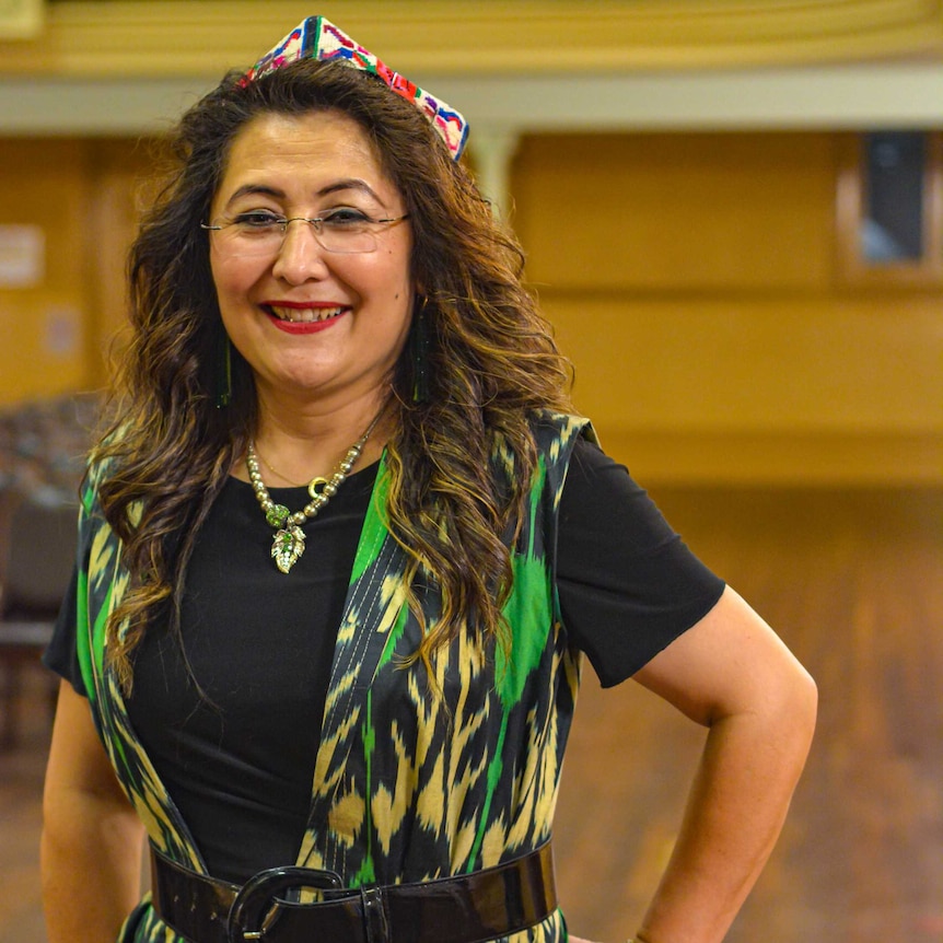 Nadire, who helped organise the Uyghur music performance in Melbourne. She is wearing a traditional hat.