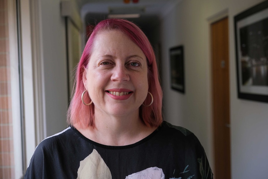 A portrait photo of Annabelle Daniel, who stares into the camera smiling.