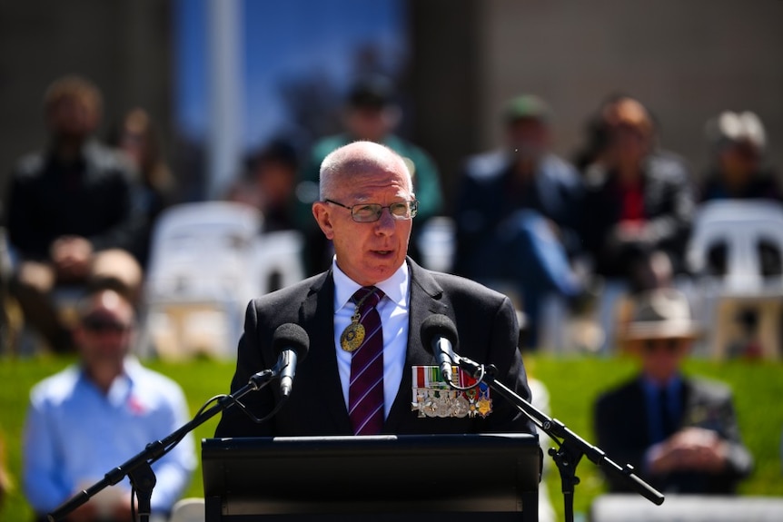 Australian Governor General David Hurley stands in front of a lectern and speaks.