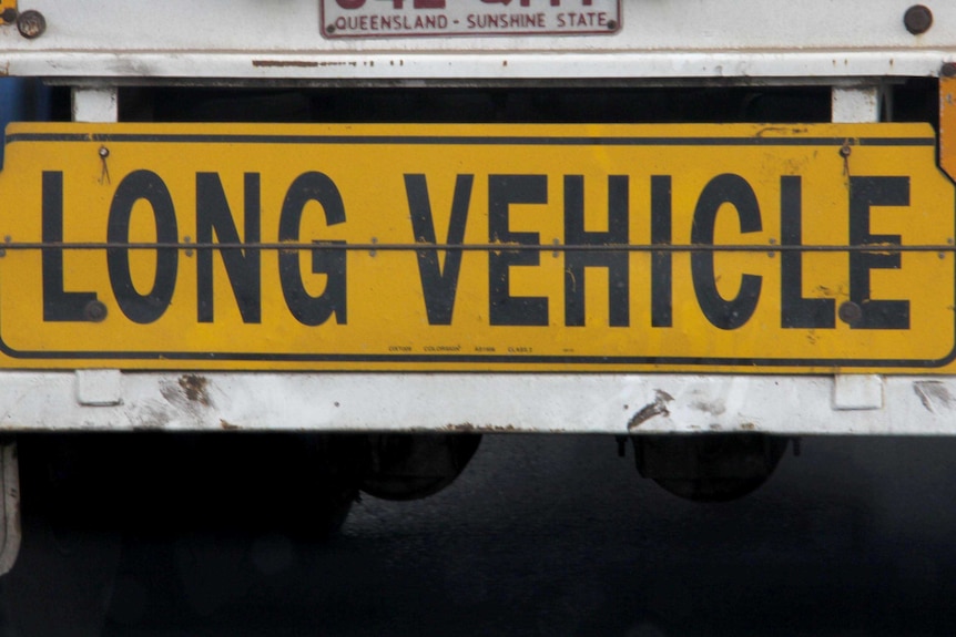 Long Vehicle sign on the back of a semi-trailer.