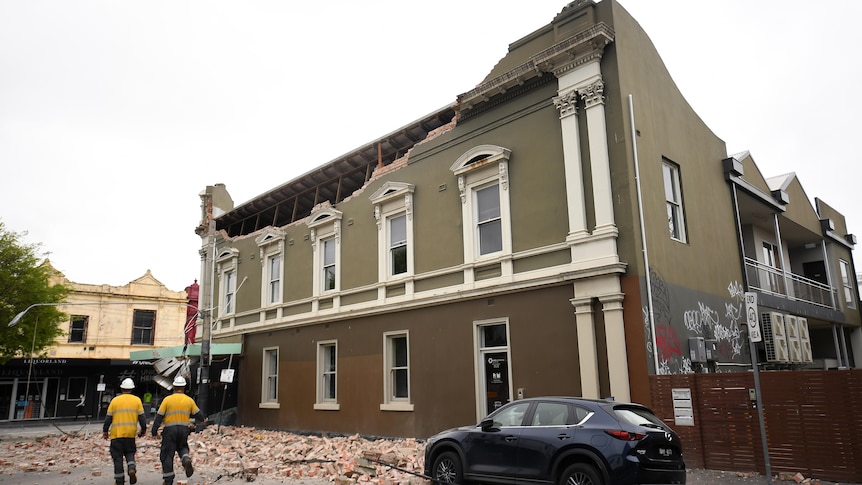 Emergency service workers on the scene of a partially collapsed building in Melbourne. 