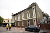 Emergency service workers on the scene of a partially collapsed building in Melbourne. 