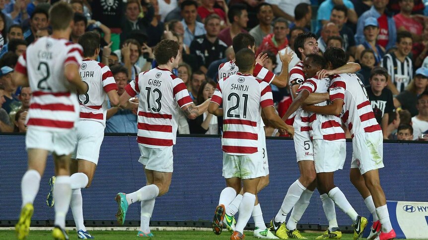 Youssouf Hersi celebrates with his Wanderers team-mates after scoring against Sydney FC.