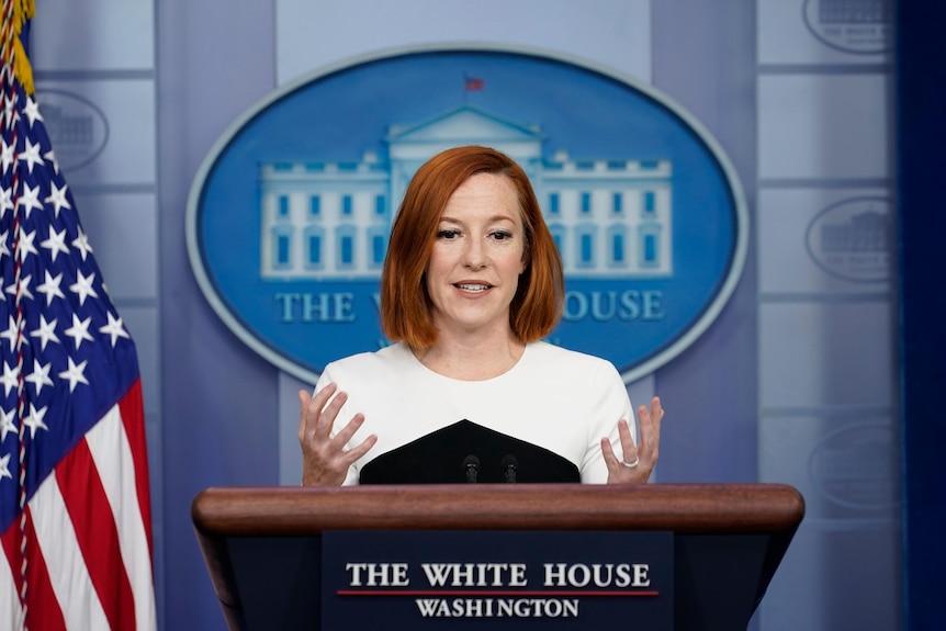 A woman stands at the White House lectern and gestures while speaking