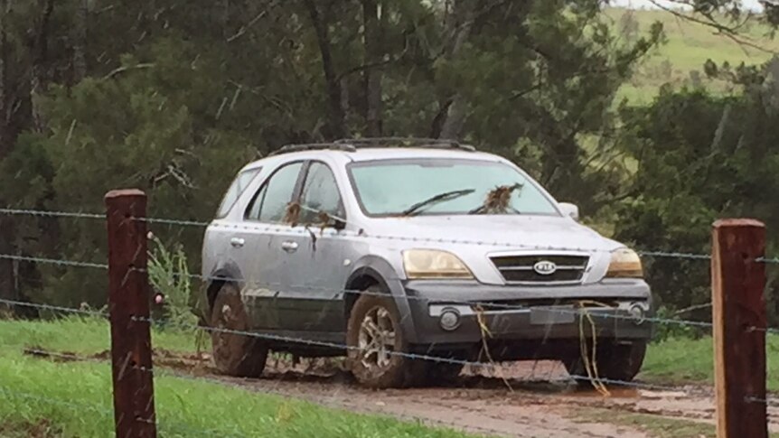 A car pulled from flood waters in Gympie after a man was swept away and drowned.