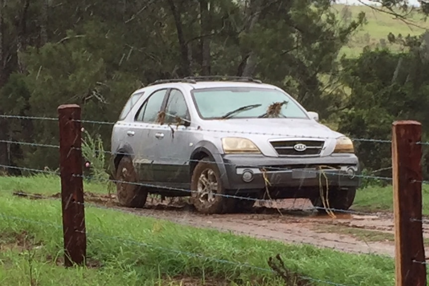 A car pulled from flood waters in Gympie after a man was swept away and drowned.