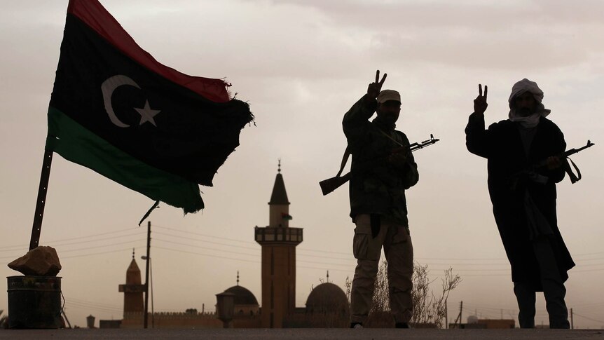 Libyan fighters man a checkpoint south of Bani Walid