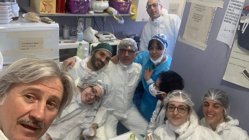 Dr Gianotti takes a selfie with colleagues.