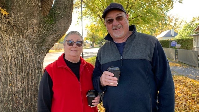 Steve and Chris Robinson standing together holding a coffee, Ross, Tasmania, May 2020.