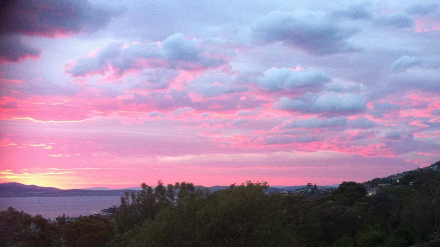 A pink sky greeted Hobart residents  this morning with the mercury still hovering in the mid-20s.
