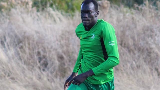 midfielder Riaq Ngor-Apuol runs with the ball