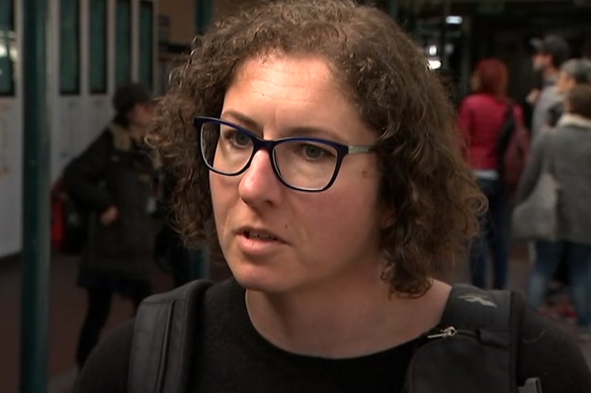 A woman at a train station