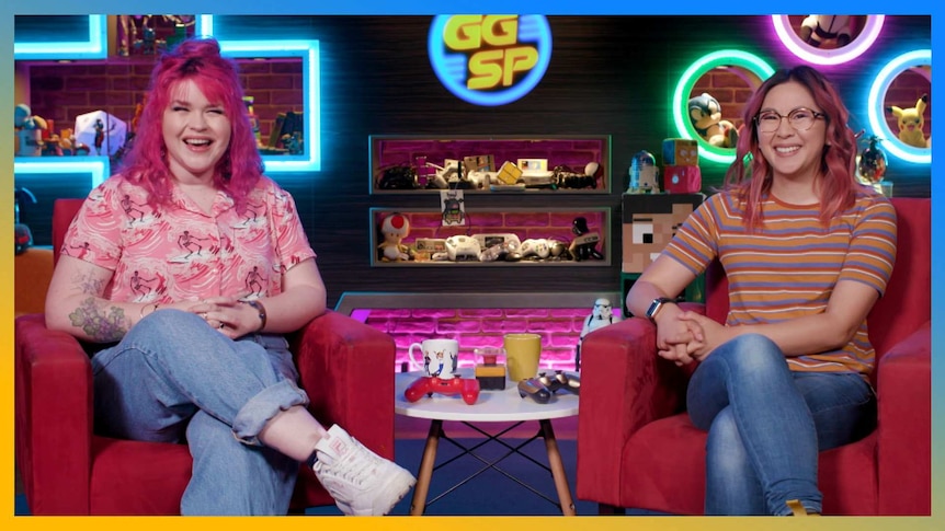 Rad and Gem sitting on lounges on the GGSP set